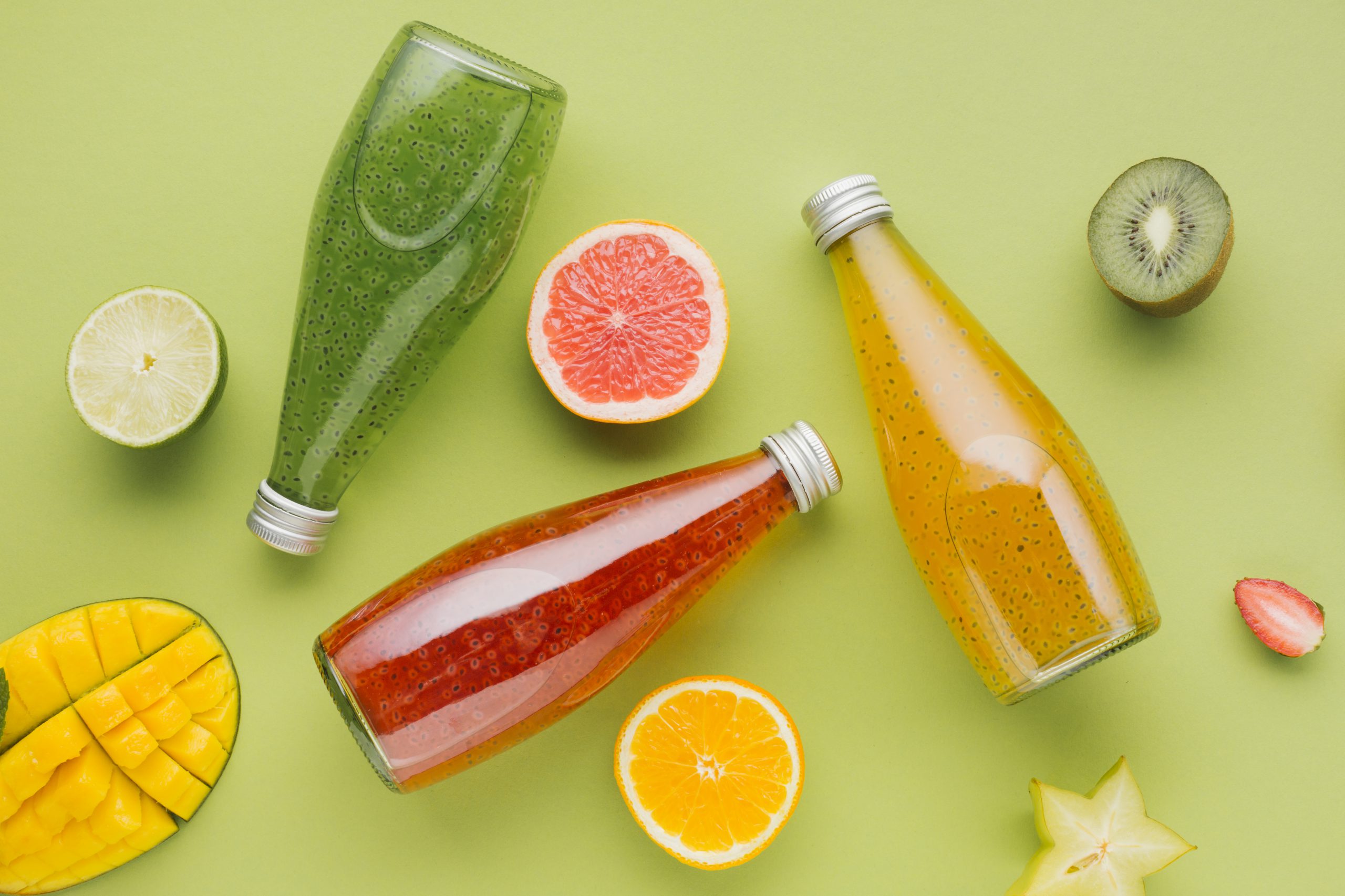 colorful-juice-bottles-fruit-slices